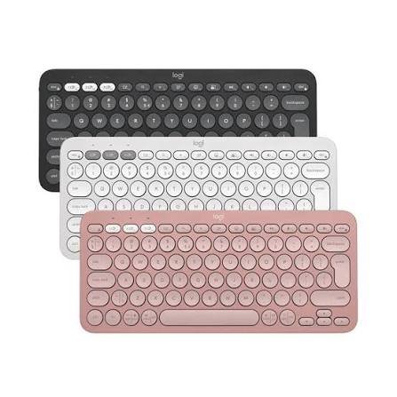 Best wireless keyboard for MacBook Air on a desk beside a laptop